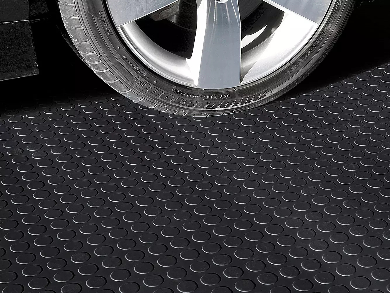 PVC coin mat roll used for vehicle garage and workshop flooring